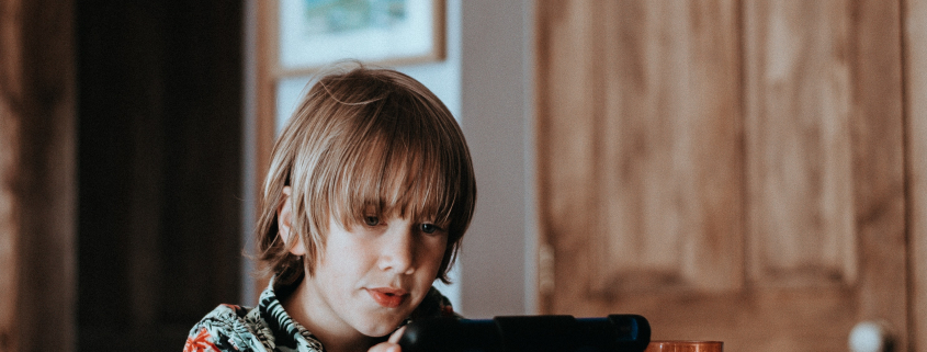 boy looking at a screen